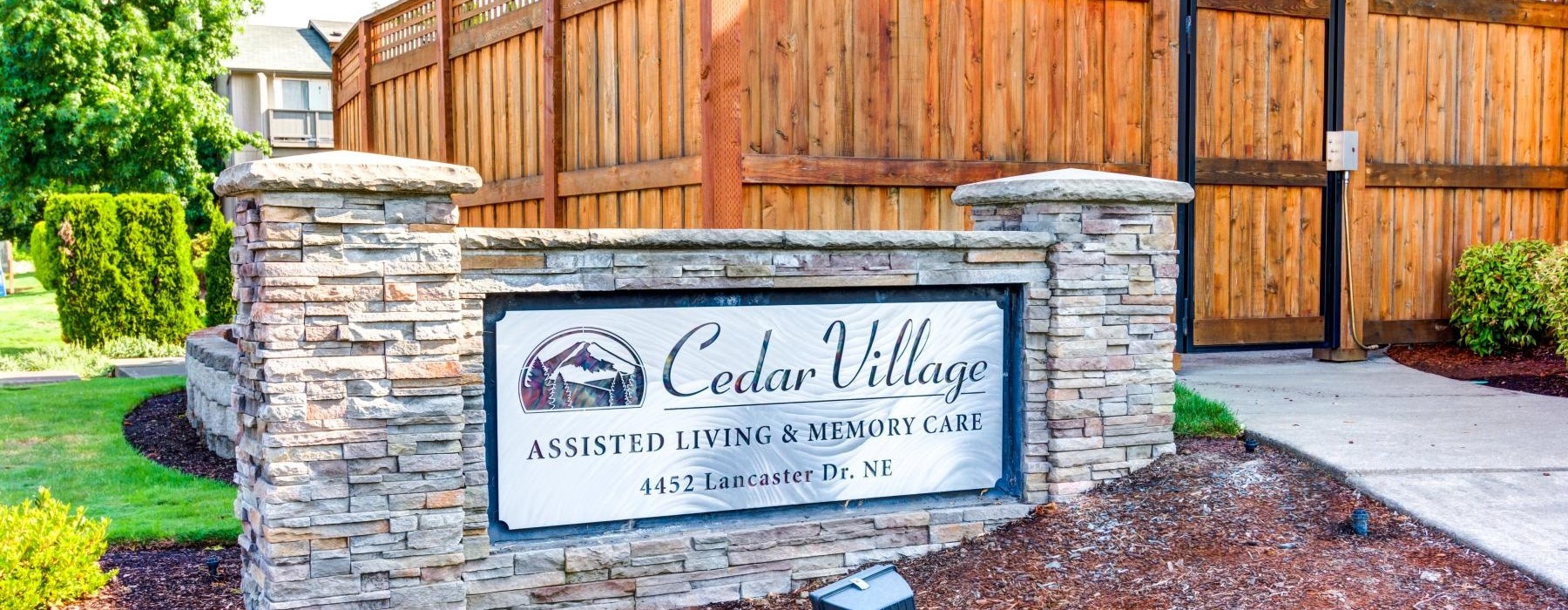 a sign on a stone wall